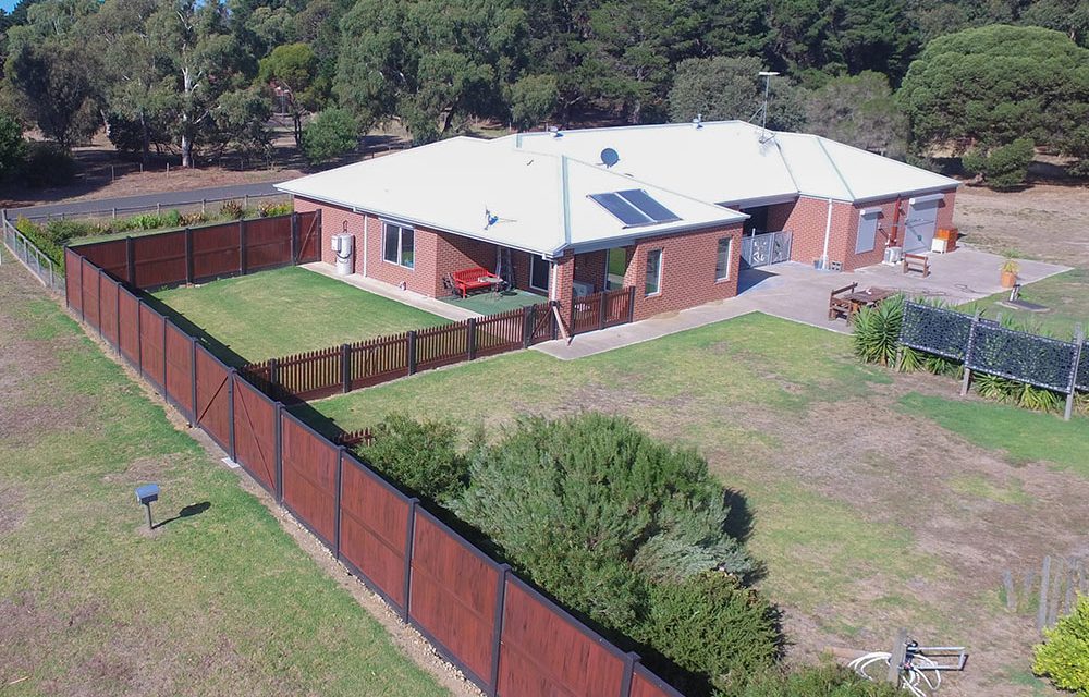 Think-Fencing-Custom-PVC-Panel-Fence-Ridge-and-Red-Gum-6